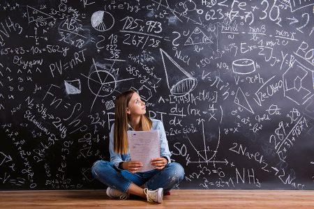 girl in front of a blackboard